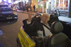3 Dec 2019 - London, UK - Faux Bojo (Drew Galdron) in mini at Old Compton Street in a stunt organised and crowdfunded by anti-brexit campaigning group EU Flag Mafia.